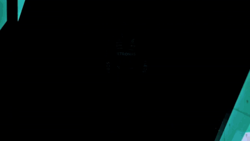 Man In Petronas Uniform Standing In Dark Room GIF