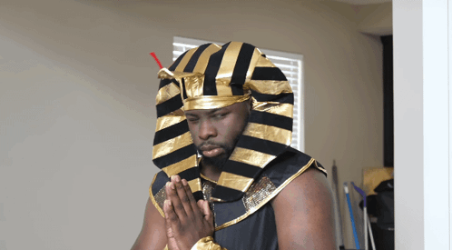 Man In Pharaoh Costume Hands Folded GIF