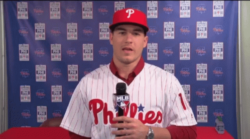 Man in Phillies Jersey Holding Microphone