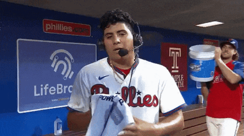 Man in Phillies Jersey in Front of LifeBRC Sign