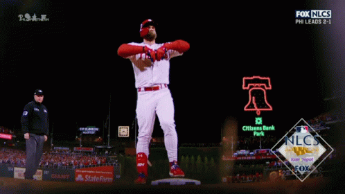 Man in Phillies Jersey Standing on Base