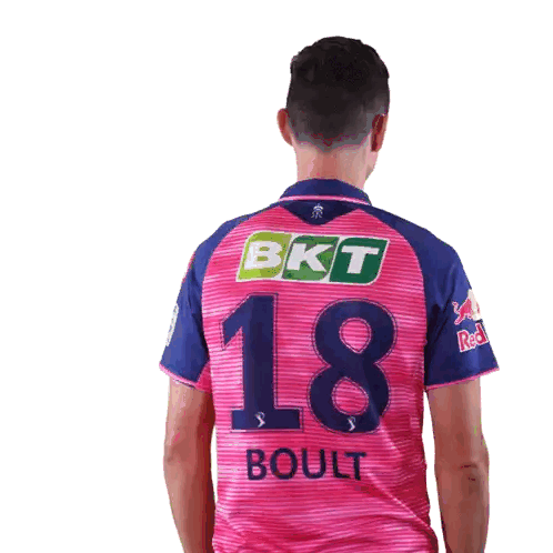 Man in Pink and Blue Jersey Number 18