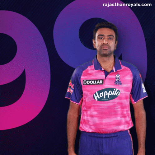 Man in Pink and Blue Shirt With Dollar Logo