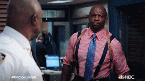 Man in Pink and Blue Striped Shirt Talking