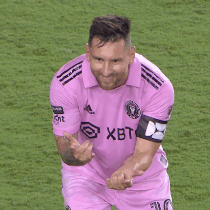 Man in Pink Exito Shirt