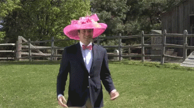 Man In Pink Hat And Bow Tie Walking GIF