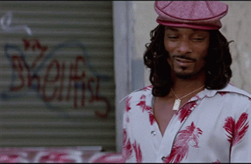 Man in Pink Hat by Snoop Dogg Sign