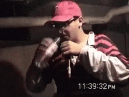 Man in Pink Hat Holding Coca Cola