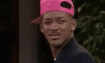 Man in Pink Hat Making Face
