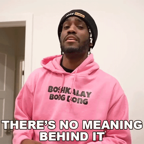 Man in Pink Hoodie and Black Beanie Saying There's No Meaning Behind It