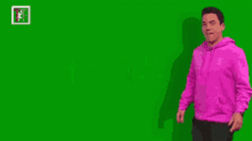 Man In Pink Hoodie Pointing At Green Screen GIF