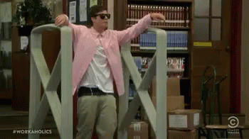 Man in Pink Jacket and Sunglasses by Giant Tape Dispenser