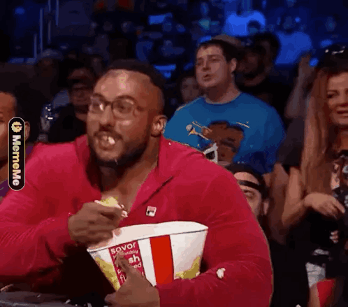 Man in Pink Jacket Eating Popcorn