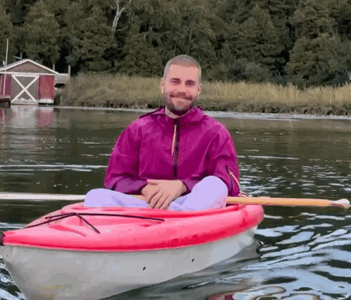Man In Pink Jacket In Red Kayak GIF
