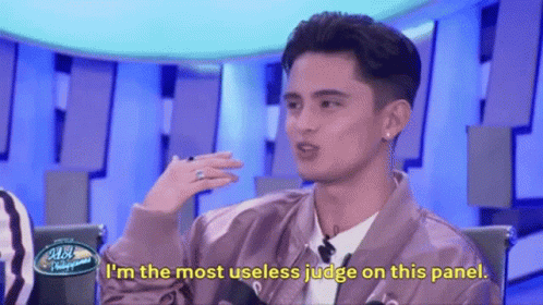 Man In Pink Jacket Saying Useless Judge GIF
