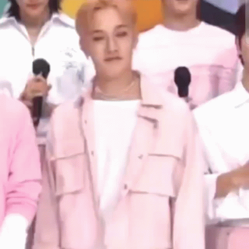 Man in Pink Jacket With Microphones