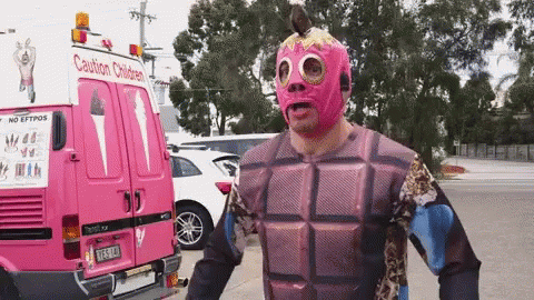 Man In Pink Mask In Front Of Pink Caution Children Van GIF