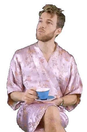 Man In Pink Robe Holding Coffee Cup