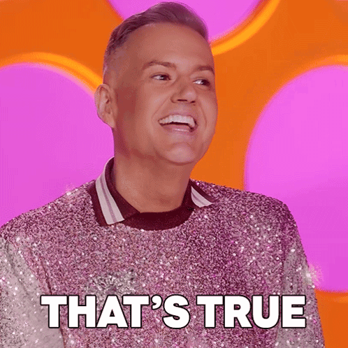 Man in Pink Sequined Sweater Smiling