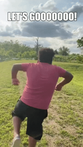 Man In Pink Shirt And Black Shorts Running GIF