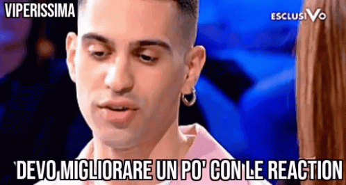 Man in Pink Shirt and Hoop Earrings Says Devo Migliorare Un Po Con Le Reaction