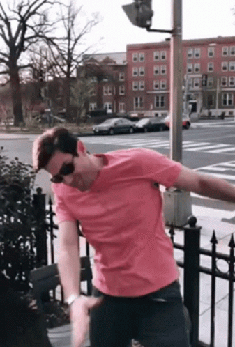 Man in Pink Shirt and Sunglasses on Street