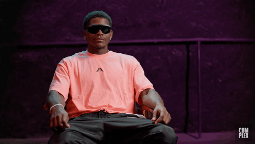 Man in Pink Shirt and Sunglasses