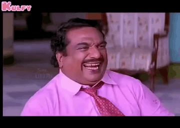 Man in Pink Shirt and Tie Laughing on Chair