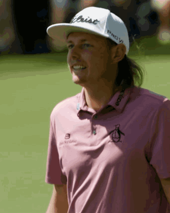 Man in Pink Shirt and White Titleist Hat