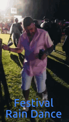 Man in Pink Shirt Dancing at Festival