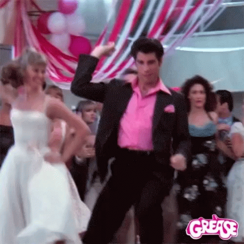 Man in Pink Shirt Dancing with Woman in White Dress