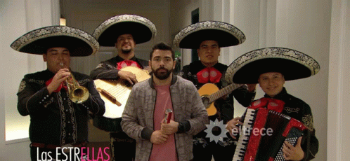 Man in Pink Shirt in Front of Mariachi Band