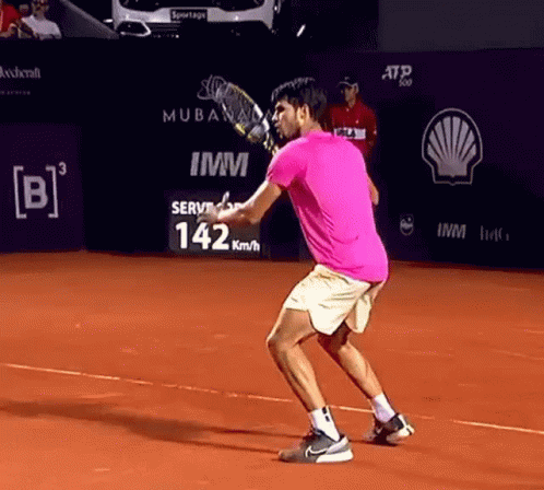 Man In Pink Shirt Playing Tennis GIF