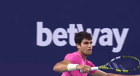 Man In Pink Shirt Playing Tennis Betway GIF