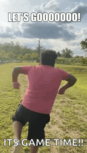 Man In Pink Shirt Running In Field GIF