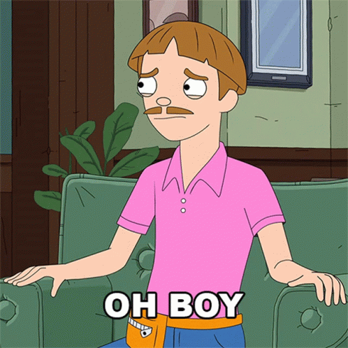 Man in Pink Shirt Sitting on Green Couch
