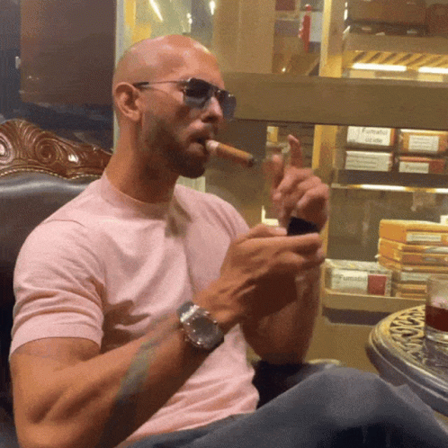 Man in Pink Shirt Smoking Cigar