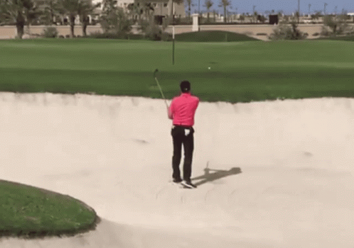 Man In Pink Shirt Swinging Golf Club GIF