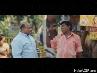 Man In Pink Shirt Talking To Man In Blue GIF