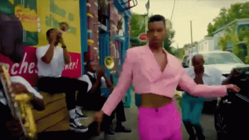 Man in Pink Suit Dancing With Band
