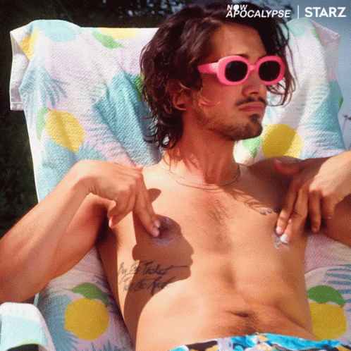 Man in Pink Sunglasses Lying on Towel