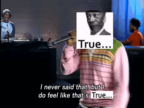 Man in Pink Sweater Holding Microphone