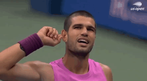 Man In Pink Tank Top Covering Ears GIF