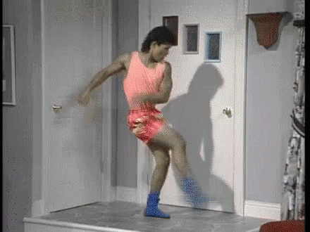 Man in Pink Tank Top Dancing