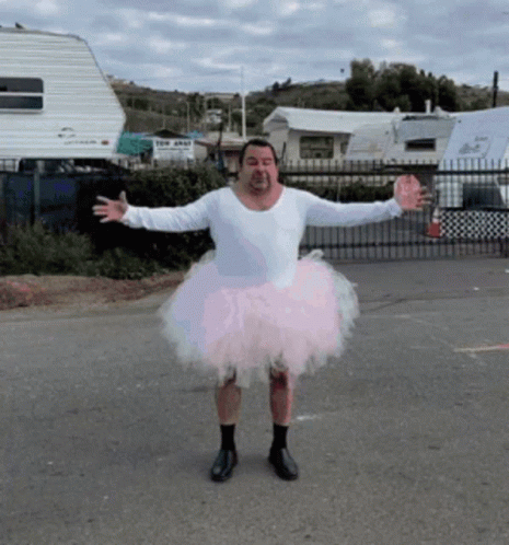 Man in Pink Tutu and White Shirt