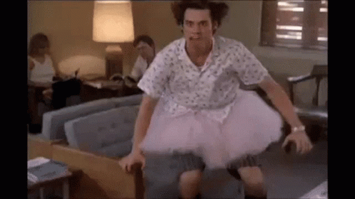 Man In Pink Tutu Sitting On Couch GIF