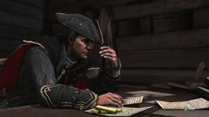 Man in Pirate Hat Lying on Table Saying B