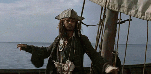 Man In Pirate Outfit On A Boat In The Ocean GIF