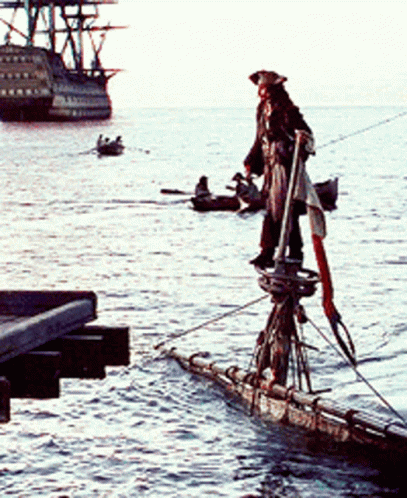 Man in Pirate Outfit on Raft