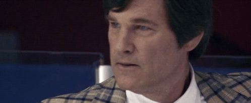 Man in Plaid Jacket and White Shirt Looking at Camera